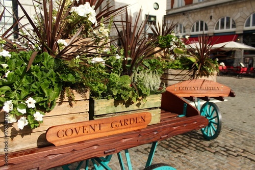 Rustic Flower Carts in Covent Garden Market Square, London, Adorned with Lush Greenery and Floral Arrangements