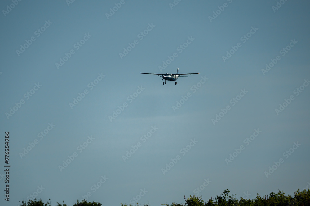 Cessna 208b Grand Caravan G-BZAH light fixed wing aircraft on final approach to landing Cessna 208b Grand Caravan G-BZAH light fixed wing aircraft on final approach to landing
