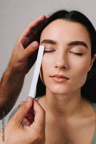 Blepharoplasty. Plastic surgeon is measuring surgical distance within eye of his patient. Preparing for blepharoplasty to correct droopy eye lids. Upper blepharoplasty.