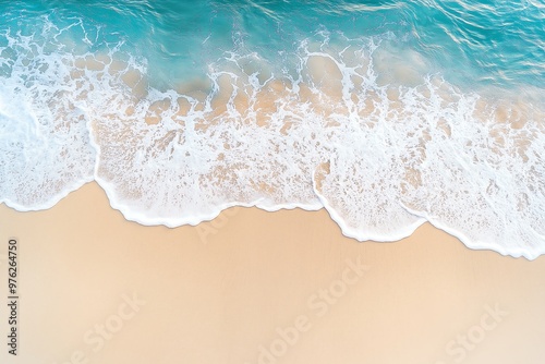 Photo of a beautiful beach with soft waves on a sandy background, top view for summer and vacation concept