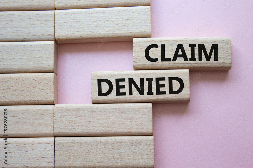 Claim denied symbol. Wooden blocks with words Claim denied. Beautiful pink background. Business and Claim denied concept. Copy space. Claim denied symbol. Wooden blocks with words Claim denied. Beautiful pink background. Business and Claim denied concept. Copy space.