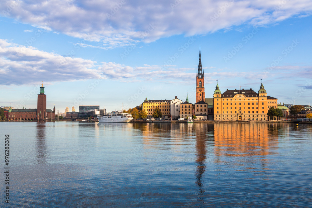 Stockholm, Sweden - 1 October 2022: Gamla Stan, old town in Stockholm at sunset with Riddarholmskyrkan church Stockholm, Sweden - 1 October 2022: Gamla Stan, old town in Stockholm at sunset with Riddarholmskyrkan church