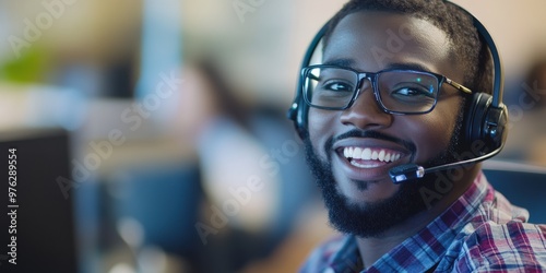 A person wearing headphones is focused on their work, sitting in a busy office environment, representing productivity, concentration, and modern corporate work culture. photo