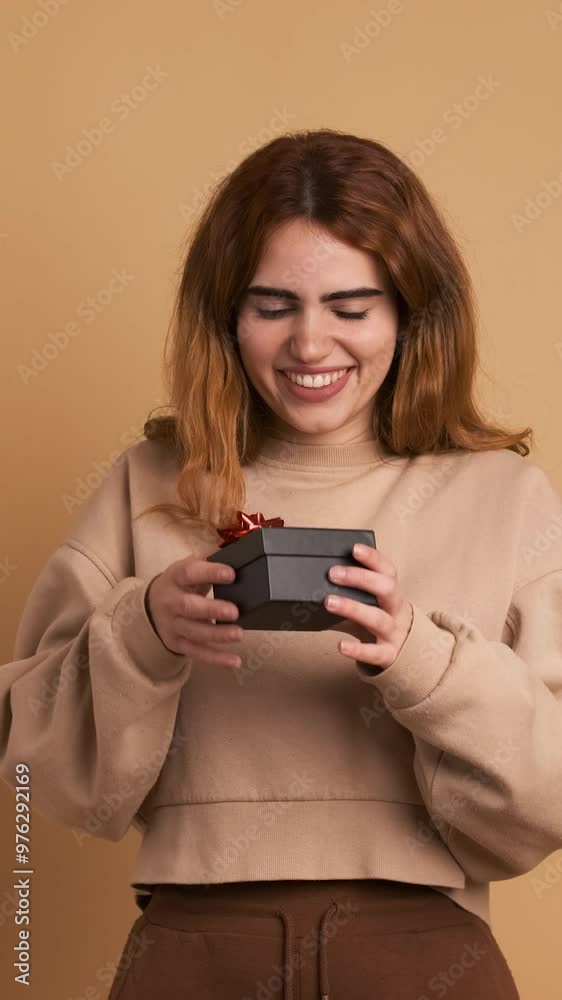 Surprised woman receiving a gift and smiling. Vertical Footage Surprised woman receiving a gift and smiling. Vertical Footage