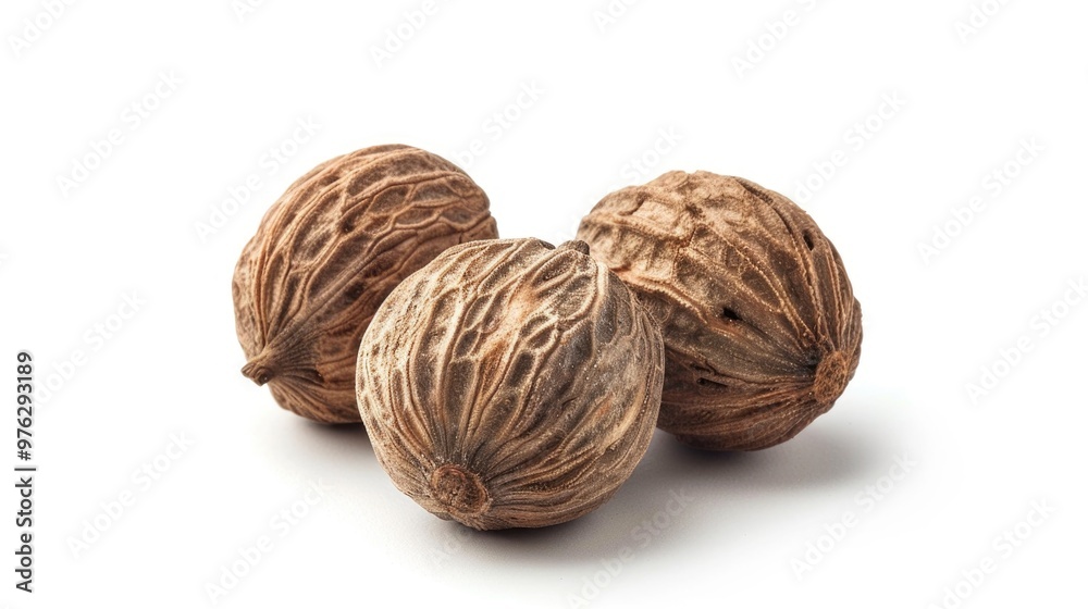 Close-up of three whole walnuts on a white background, great for food or texture photography Close-up of three whole walnuts on a white background, great for food or texture photography