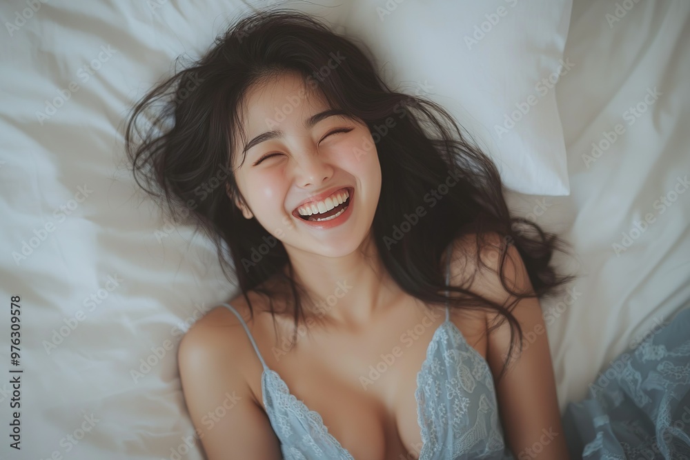 Beautiful Korean women, in a happy mood, wearing a blue dress, smiling and laughing, with a white pillow in the background, laying on a bed, in natural light, captured with a Canon EOS Beautiful Korean women, in a happy mood, wearing a blue dress, smiling and laughing, with a white pillow in the background, laying on a bed, in natural light, captured with a Canon EOS