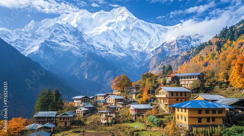 A quaint village nestled in the foothills of a majestic snow-capped mountain range.