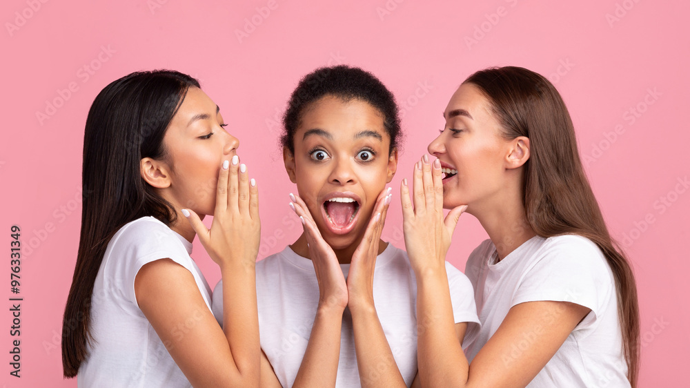 Three Gossip Girls Whispering Secrets Sharing Rumors Standing In Studio Over Pink Background. Panorama Three Gossip Girls Whispering Secrets Sharing Rumors Standing In Studio Over Pink Background. Panorama