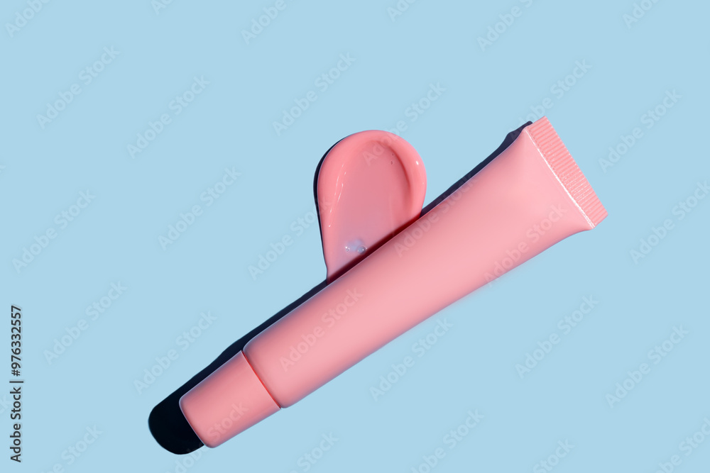 pink lip tint texture, cosmetics beauty product texture, liquid blush, lipstick, lip gloss swatches, package tube on blue