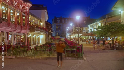 Timelapse. Chamonix, France Tourists walking on the streets of in resort Chamonix-Mont-Blanc in France in the evening at summer. All-season resort