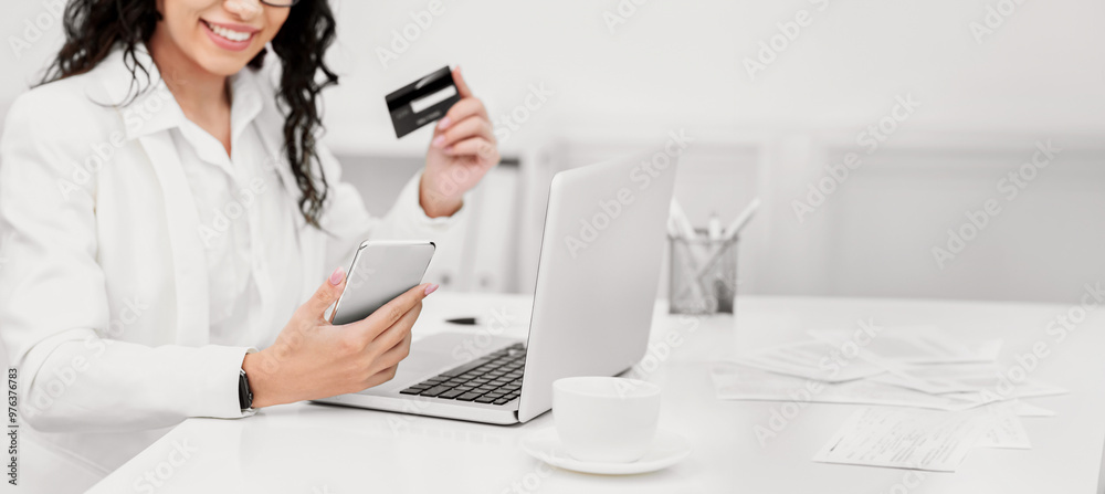 Online Shopping. Satisfied woman using smartphone and credit card to buy stuff on the Internet Online Shopping. Satisfied woman using smartphone and credit card to buy stuff on the Internet