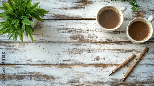 Two cups of coffee on a rustic wooden table near a window with potted plants ...