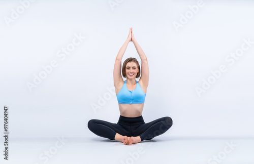 Full body length gaiety shot athletic and sporty woman doing healthy and meditative yoga exercise workout posture on isolated background. Healthy active and body care lifestyle