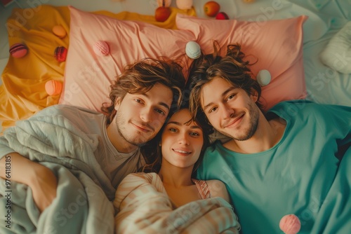 Cozy romantic breakfast in bed with friends surrounded by colorful treats and blankets photo