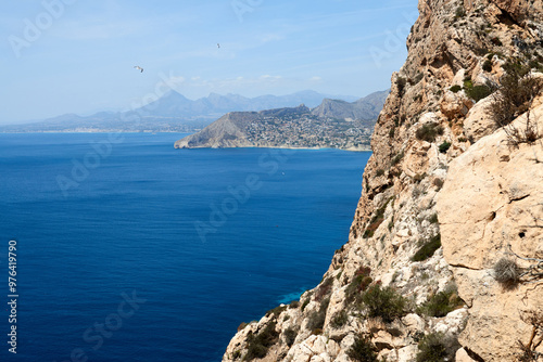 Breathtaking Panoramic Mountain View: Majestic Sea, Dramatic Sky, and Rugged Cliff Edge Overlooking Coastal Horizon. Awe-Inspiring Coastal Landscape: Stunning Aerial Perspective of Ocean, Cloudscape