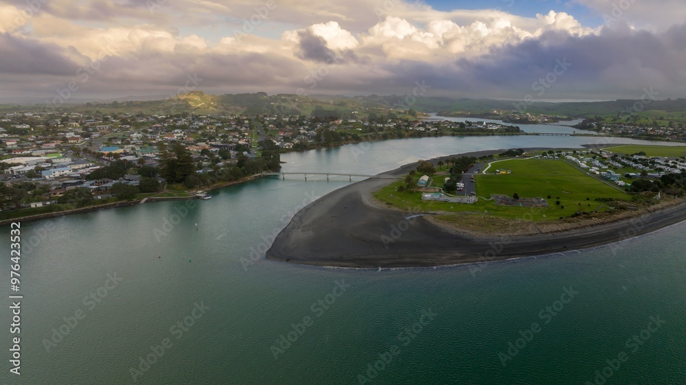 Fototapeta premium Harbour and beach in the rural town of Raglan, Waikato, New Zealand.