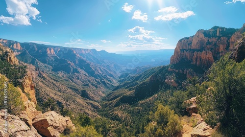 Awe-inspiring panoramic view of a rugged mountainous landscape from a scenic overlook or hiking trail photo