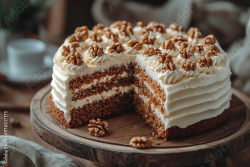 A Sliced Carrot Cake with Walnuts and White Frosting