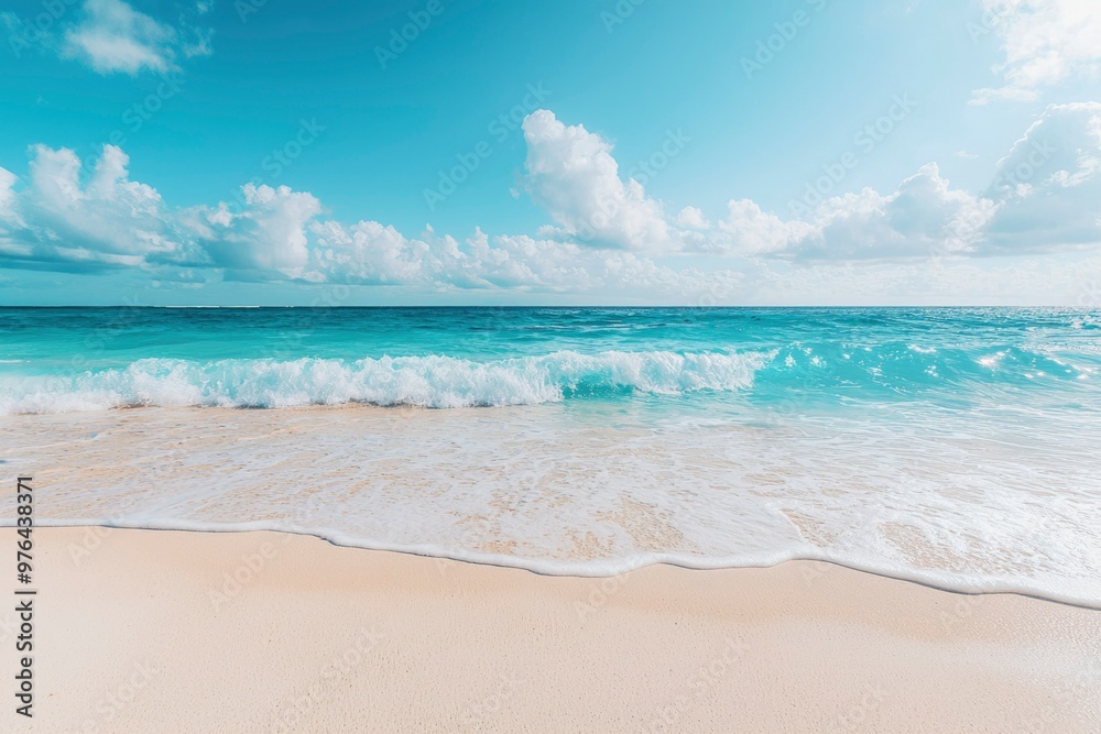A serene beach scene with white sand and blue waves under a bright sky. A serene beach scene with white sand and blue waves under a bright sky.