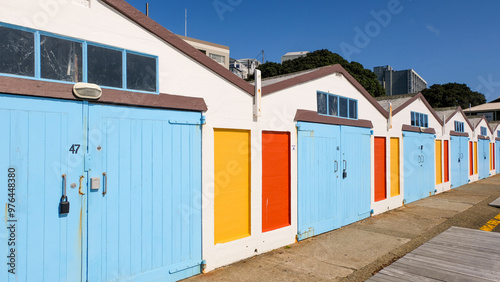 Row of colourful marina waterfront boat sheds in retro red, yellow and blue in capital city of Wellington, New Zealand Aotearoa photo