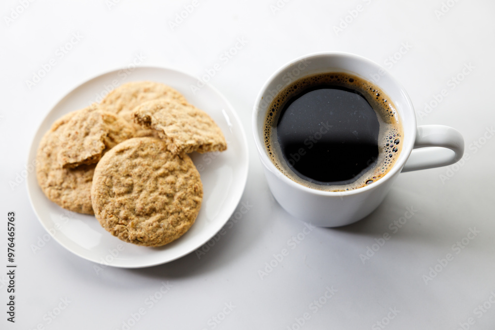 Cup of black coffee, Cookies on white marble background. Cup of black coffee, Cookies on white marble background.
