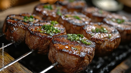 Close-up of grilled beef skewers with herbs, served on a wooden board, showcasing juicy and perfectly cooked meat.