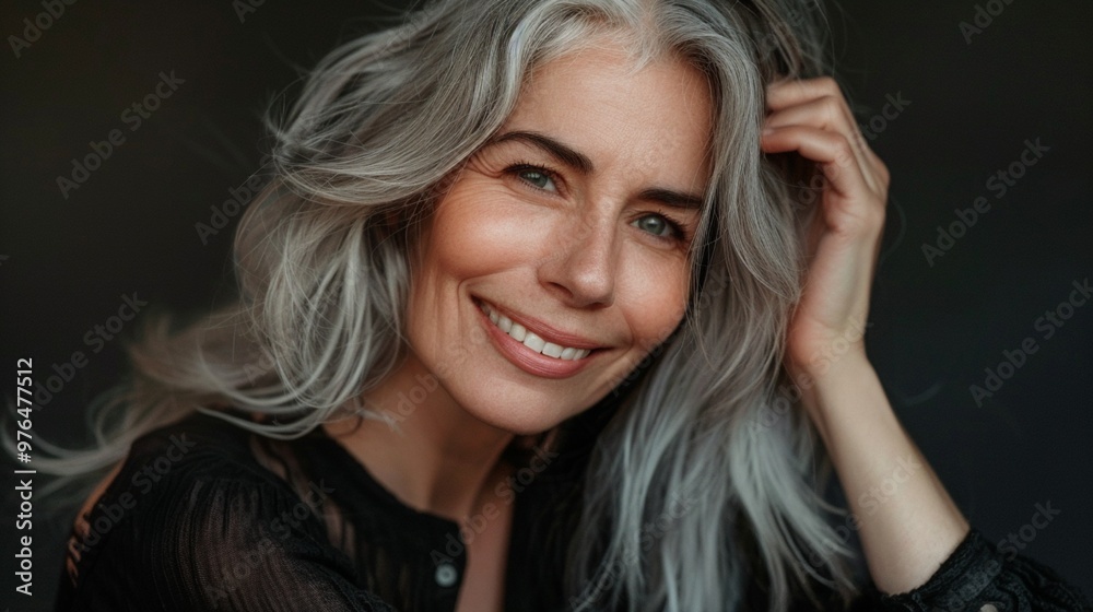 Radiant mature woman with silver hair smiles confidently, embodying grace and vitality. Her genuine expression captures the beauty of aging authentically. Radiant mature woman with silver hair smiles confidently, embodying grace and vitality. Her genuine expression captures the beauty of aging authentically.