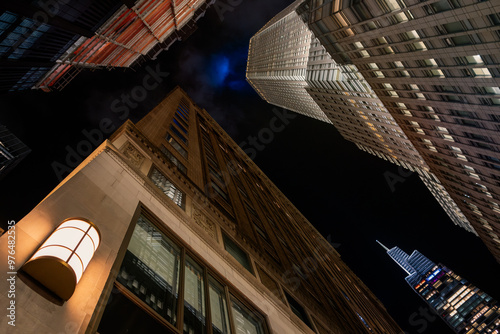 Impressive Skyscraper Illuminated Against the Night Sky in a Bustling Metropolis