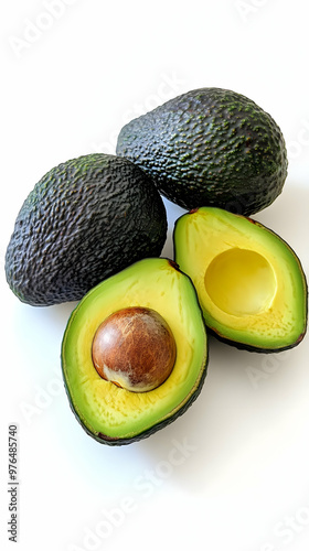 Fresh avocados showcasing their vibrant green flesh and rich brown pit, perfect for healthy recipes and nutrition.