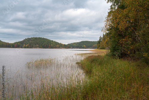 View from the shore of Lake Ladoga near the village of Lumivaara on a sunny autumn day, Ladoga skerries, Lahdenpohya, Republic of Karelia, Russia photo