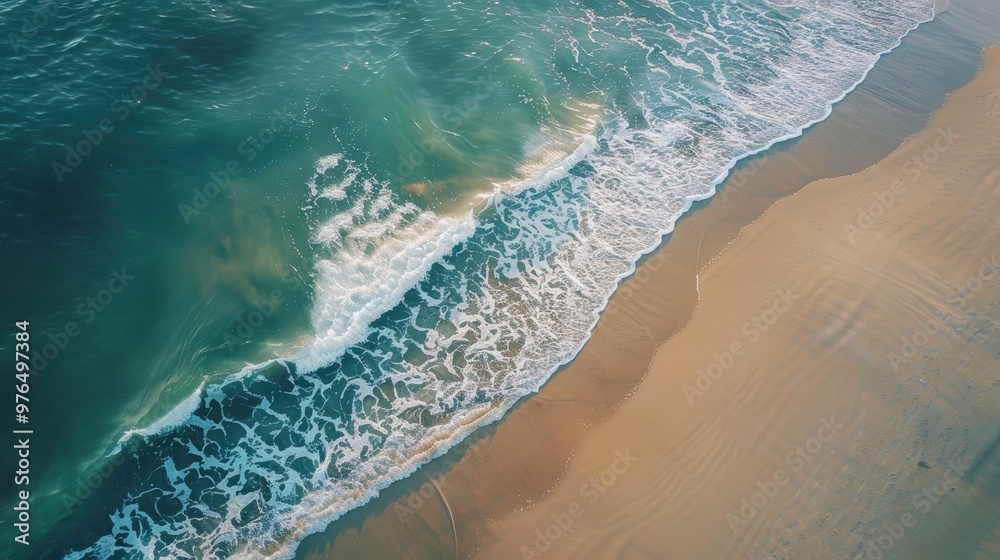 Stunning Aerial View of Turquoise Ocean Waves Crashing on a Sandy Beach. Stunning Aerial View of Turquoise Ocean Waves Crashing on a Sandy Beach.