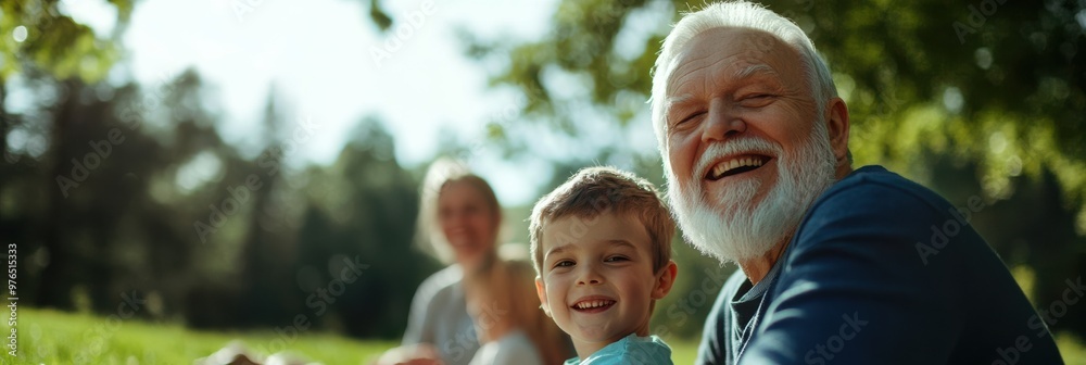 An elderly man with a white beard smiles broadly as he enjoys a sunny day at the park with his young grandson, creating a heartwarming family scene. An elderly man with a white beard smiles broadly as he enjoys a sunny day at the park with his young grandson, creating a heartwarming family scene.