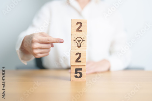 2025 block with lightbulb. Business Idea, Creative, Thinking, brainstorm, Goal, Resolution, strategy, plan, Action, change and New Year start concepts