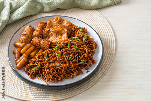 Jajangmyeon or JJajangmyeon with Odeng and Omuk - Korean Instant noodles with Korean fish cake in black bean sauce photo