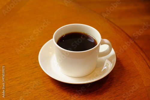 cup of coffee on wooden table