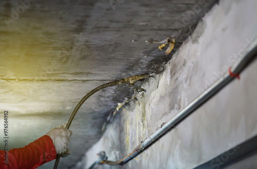 PU Foam injections for fixed water leakage under concrete floor or ceiling. Selective focus..