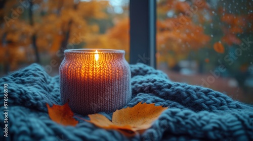 Cozy Autumn Vibes - Warm Sweater on Chair with Candle and Fall Leaves Through Window, Nikon Z6 50mm f/1.8 Lens photo