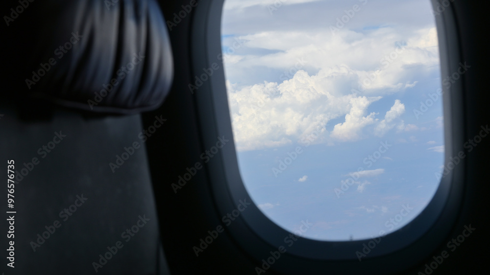 Scenery outside the window of a passenger plane, beautiful blue sky and white cloud view Scenery outside the window of a passenger plane, beautiful blue sky and white cloud view