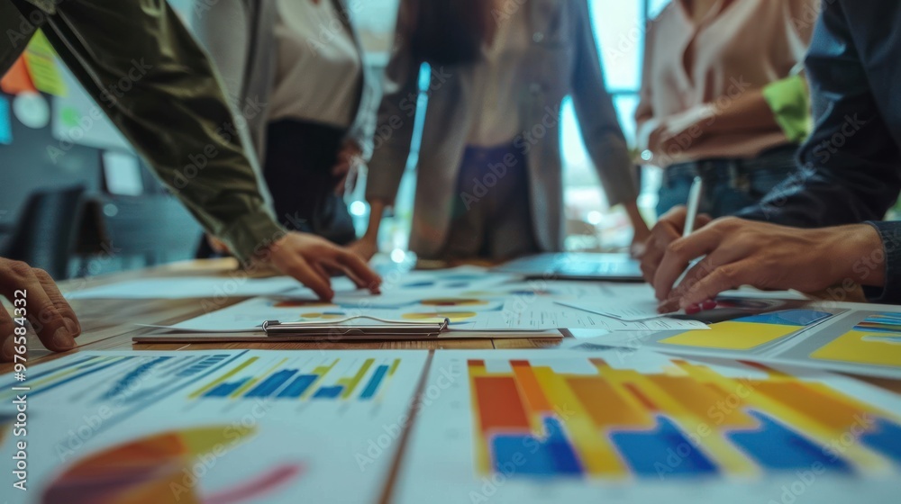 A mid-market business manager reviewing performance metrics with their team A mid-market business manager reviewing performance metrics with their team