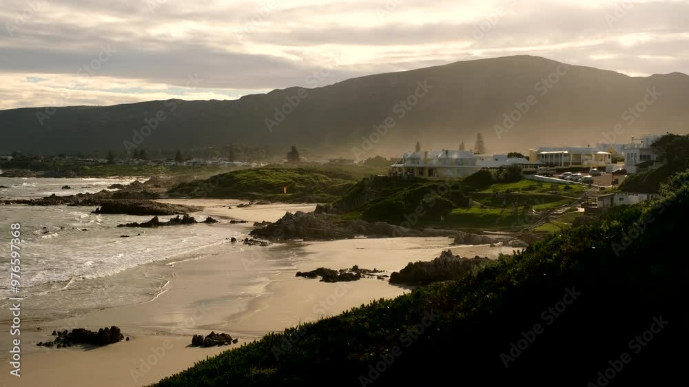 Timelapse sunset view over scenic Voëlklip beach in Hermanus holiday destination Timelapse sunset view over scenic Voëlklip beach in Hermanus holiday destination