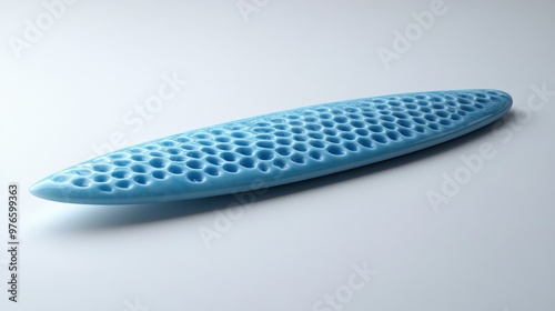 A blue surfboard with a honeycomb texture for enhanced performance.