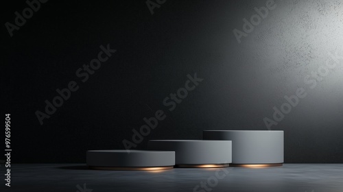 Minimalist display of three grey pedestals, softly lit against a dark background, perfect for showcasing products or art.