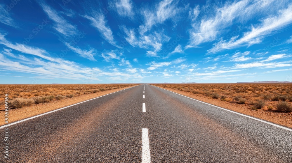 long straight road through the Australian Outback, with red earth, sparse vegetation long straight road through the Australian Outback, with red earth, sparse vegetation