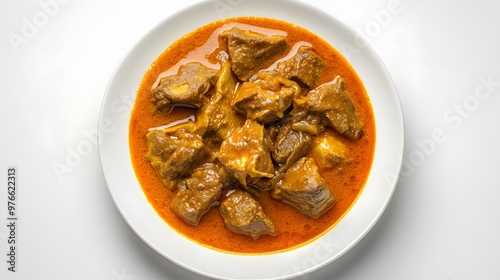 Delicious nigerian beef stew in rich tomato sauce on white plate