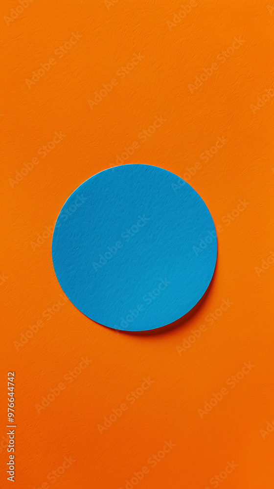 A vibrant blue circle stands out against bold orange background, creating striking visual contrast that captures attention and evokes sense of playfulness A vibrant blue circle stands out against bold orange background, creating striking visual contrast that captures attention and evokes sense of playfulness