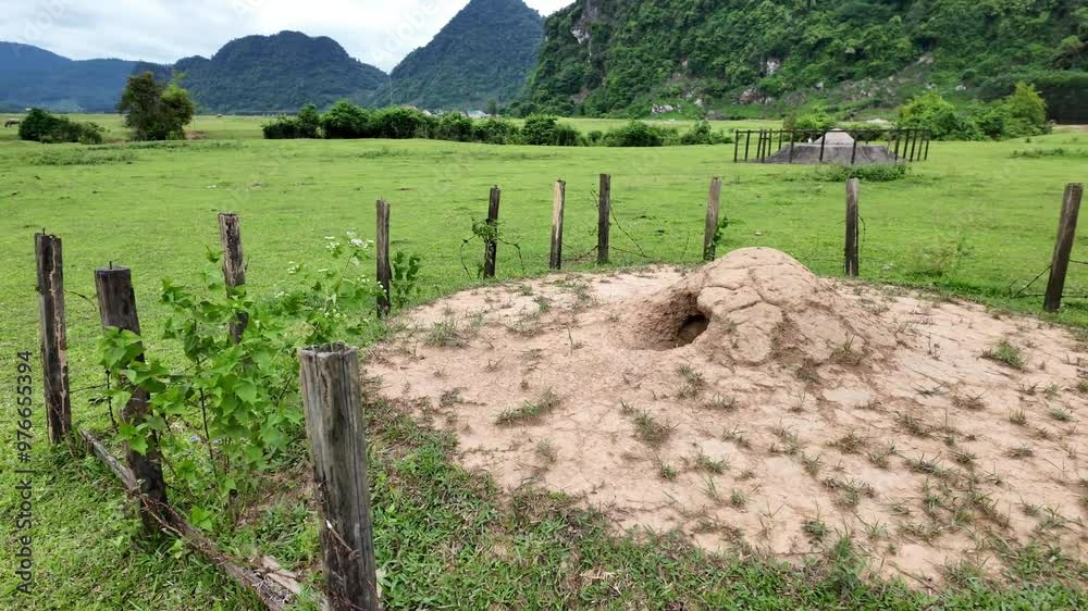 Quang Binh countryside landscape with cultural customs of ethnic minority, circular tomb as hat shape from concrete to burial deceased, mountain view at Tu Lan village, Viet Nam Quang Binh countryside landscape with cultural customs of ethnic minority, circular tomb as hat shape from concrete to burial deceased, mountain view at Tu Lan village, Viet Nam