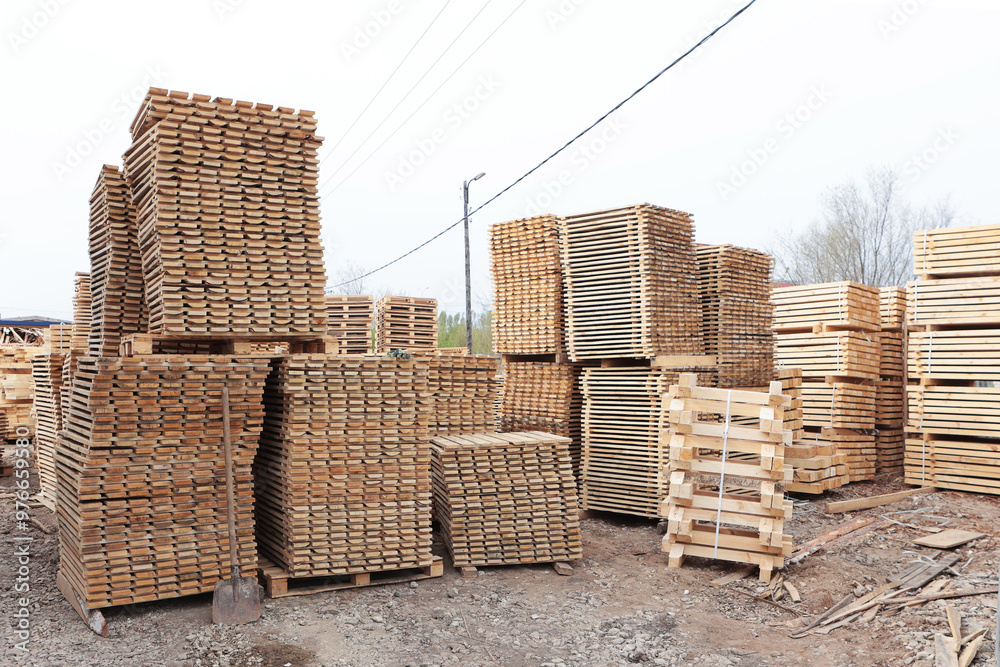 Wooden pallets for transportation of building materials.Wooden pallets are stacked. Wooden pallets for transportation of building materials.Wooden pallets are stacked.