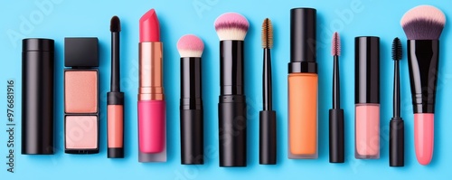 A vibrant collection of makeup products displayed on a blue background, showcasing various lipsticks, brushes, and cosmetics. photo