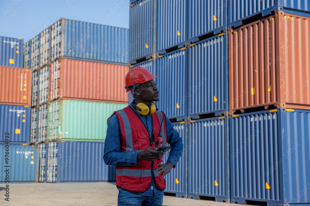 Foreman or worker work at Container cargo site check up goods in container. Foreman or worker checking on shipping containers. Logistics and shipping. Foreman or worker work at Container cargo site check up goods in container. Foreman or worker checking on shipping containers. Logistics and shipping.