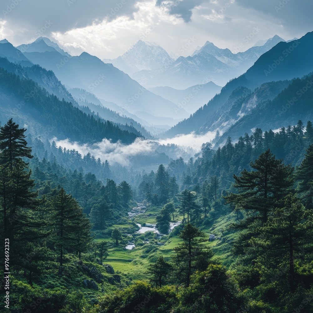 Fototapeta premium Majestic Mountain Valley with Misty Clouds and Lush Greenery